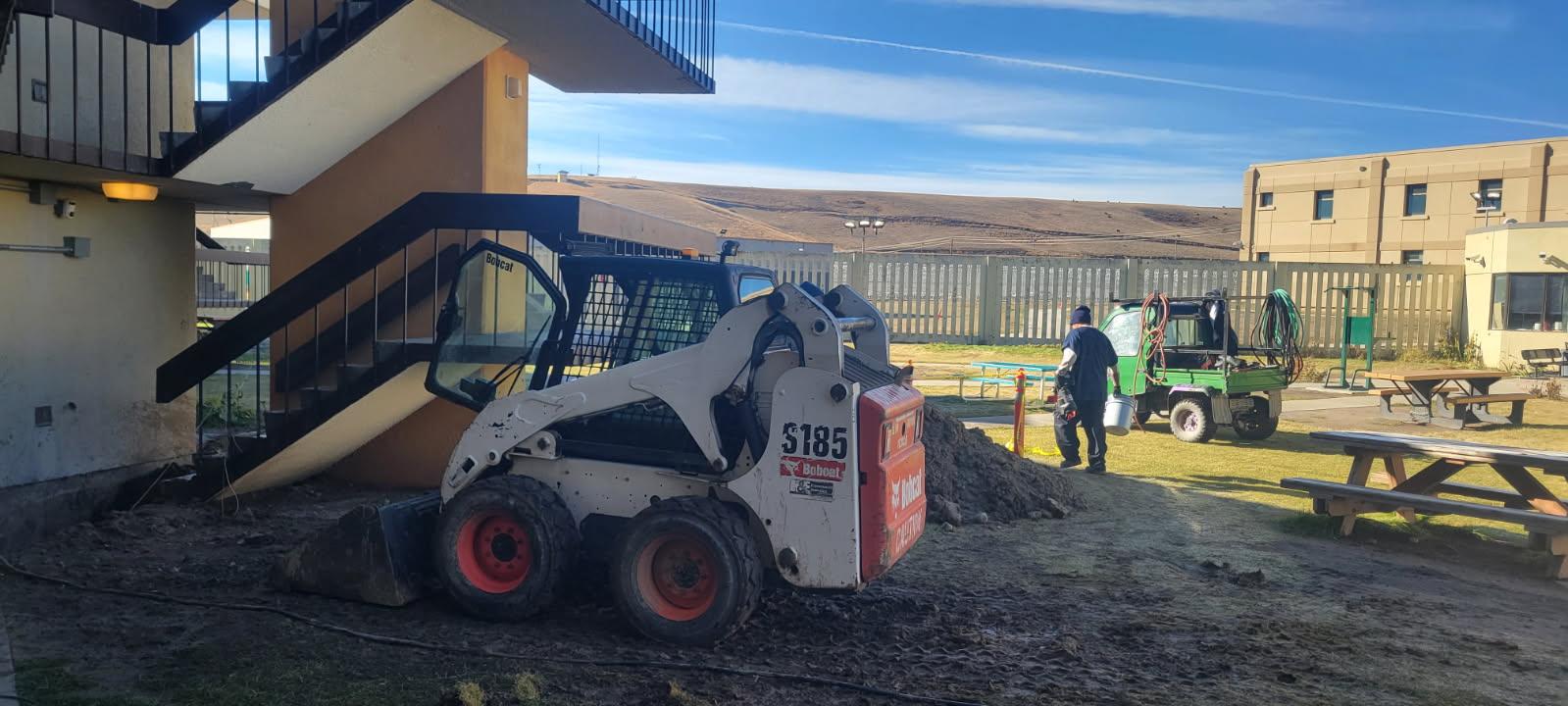 Mini excavator digging
